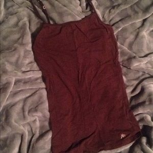 Brown tank top which is long and comfortable.